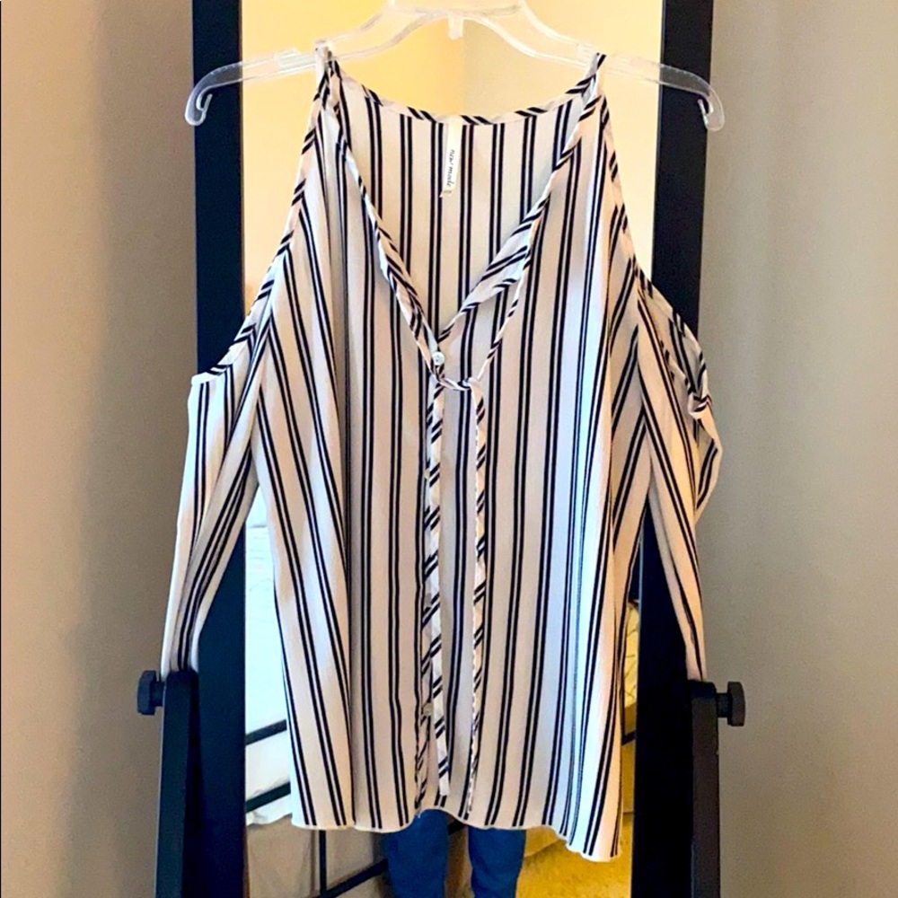 NEW blouse with cut out shoulders.